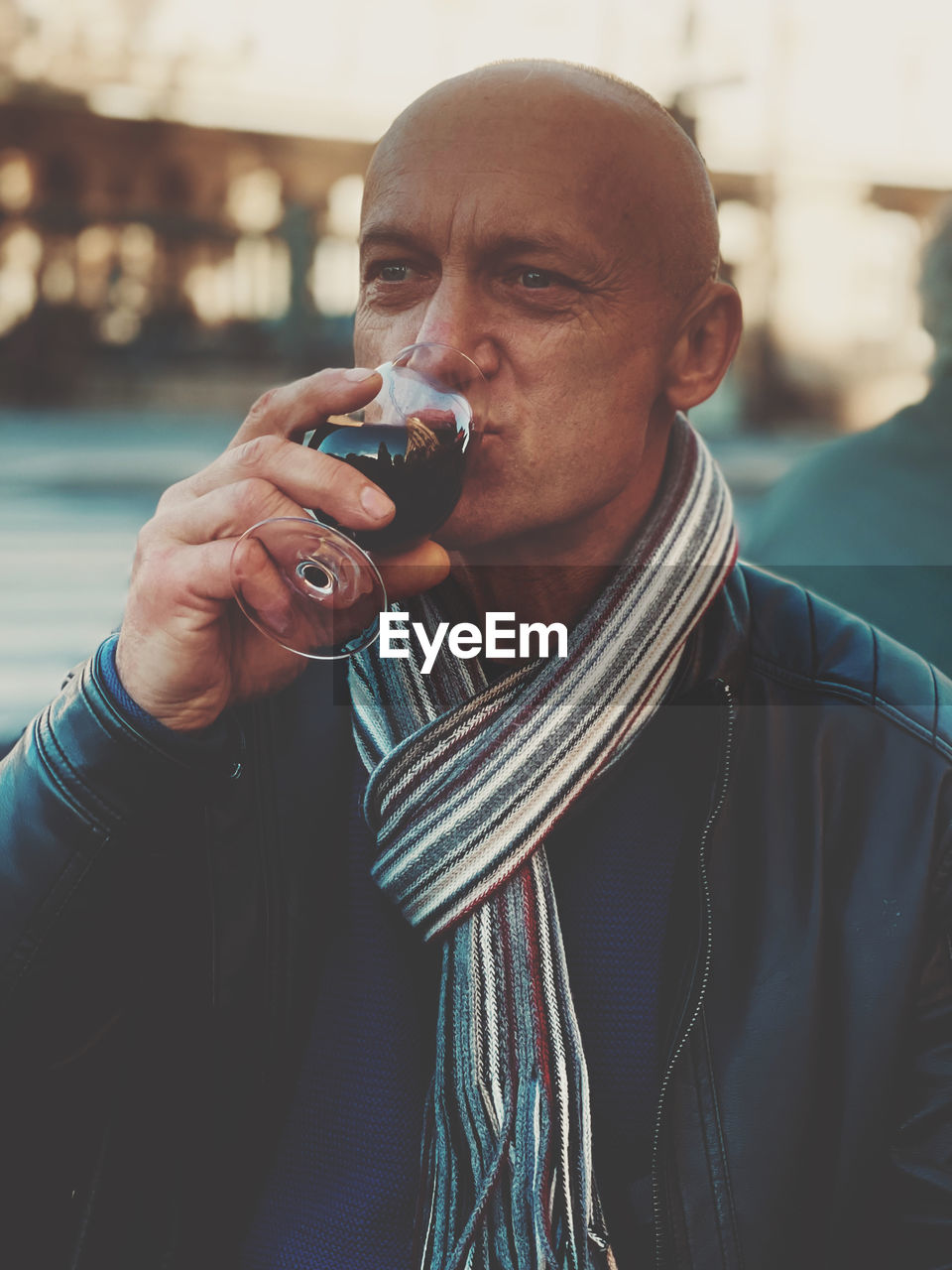 Portrait of man holding a glas of red wine