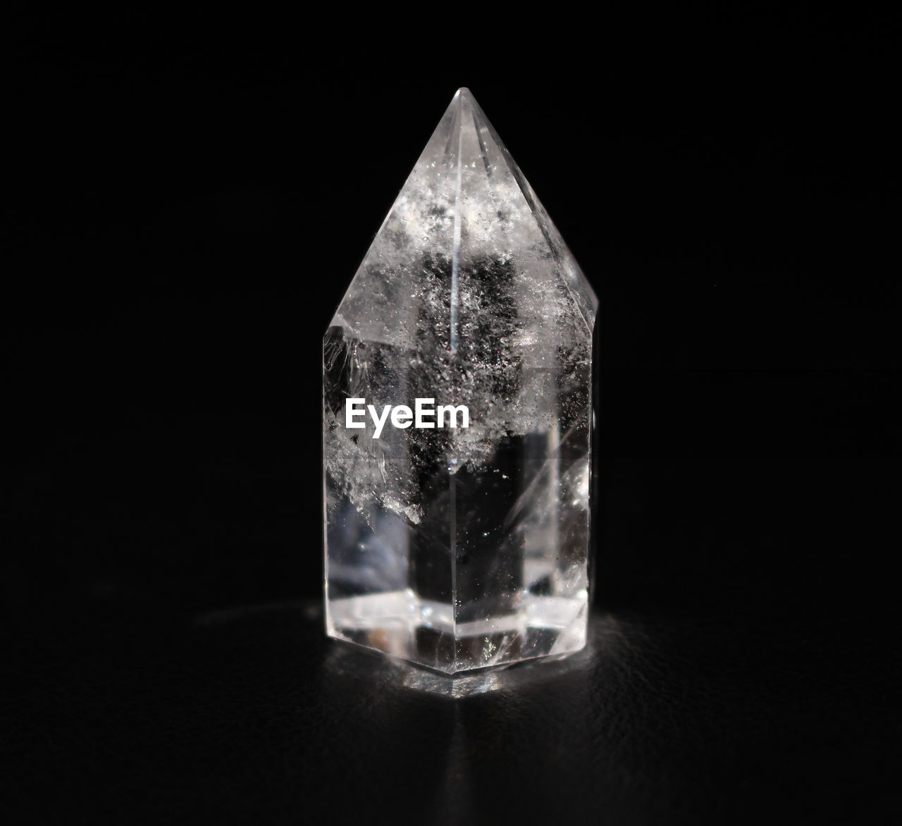 Close-up of quartz crystal on black background