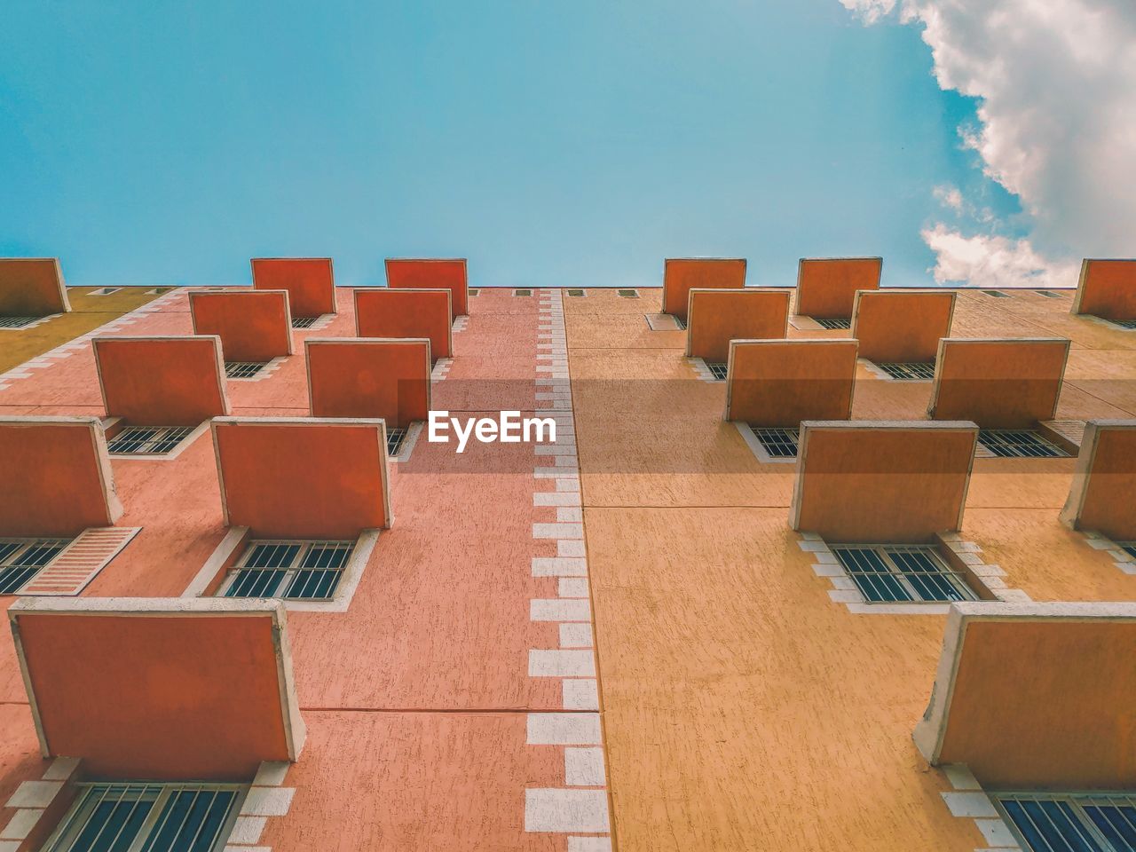 EMPTY CHAIRS AND BUILDINGS AGAINST CLEAR SKY