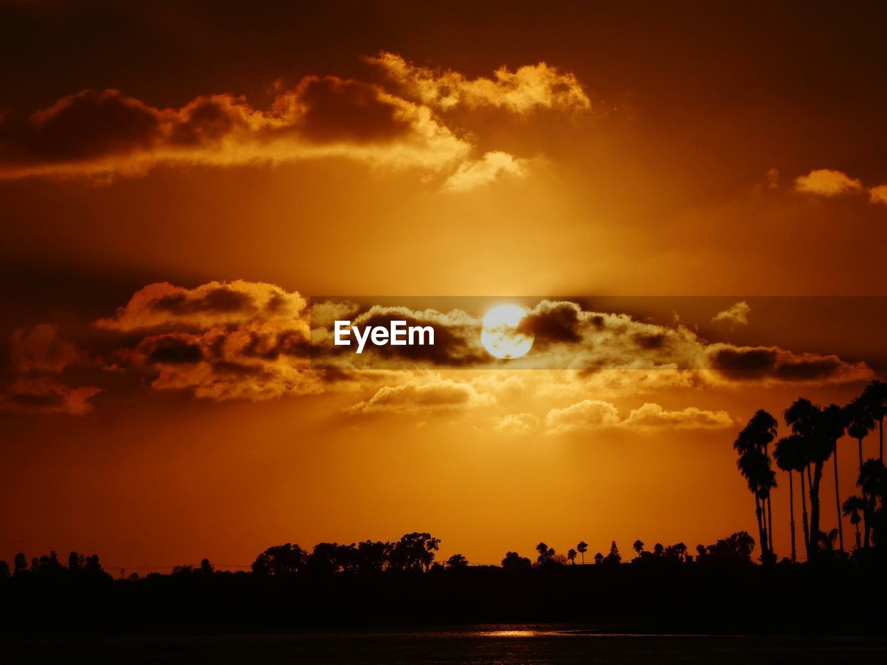 Scenic view of dramatic sky during sunset