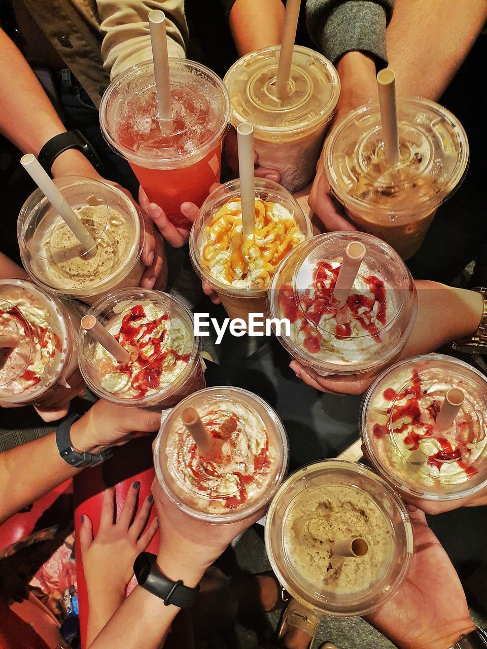 HIGH ANGLE VIEW OF PEOPLE HAVING FOOD AT RESTAURANT