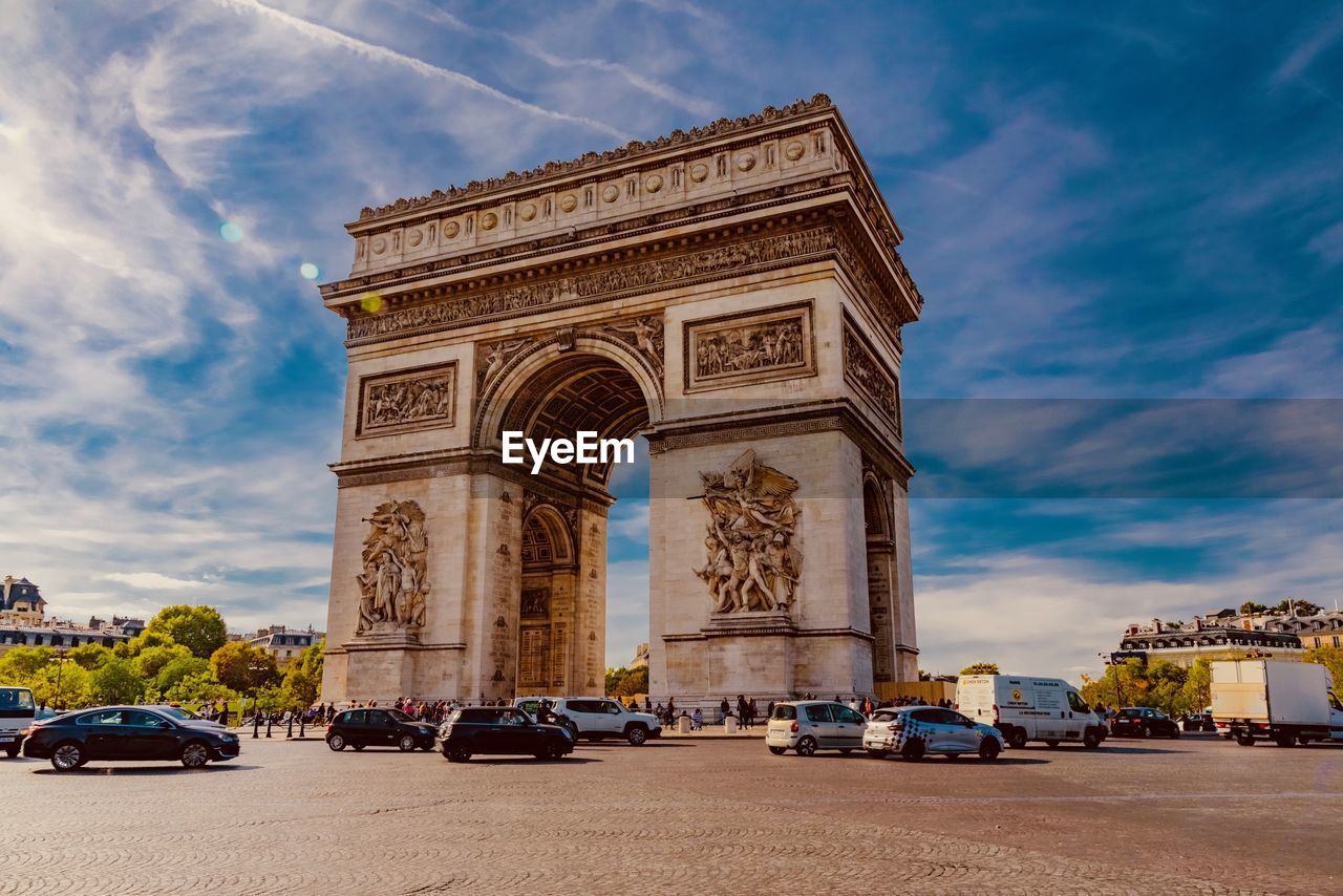 Low angle view of arc de triomphe in city