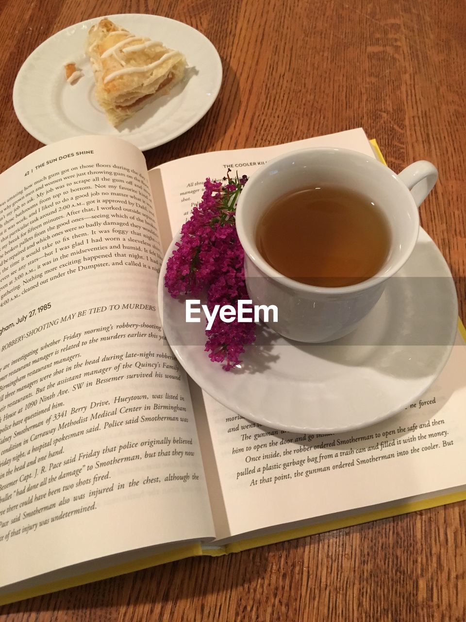 HIGH ANGLE VIEW OF COFFEE CUP AND BOOK ON TABLE