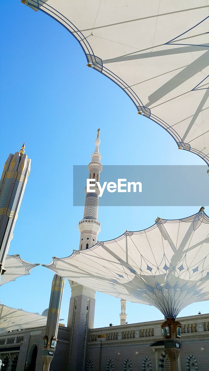 LOW ANGLE VIEW OF BUILT STRUCTURES AGAINST CLEAR SKY