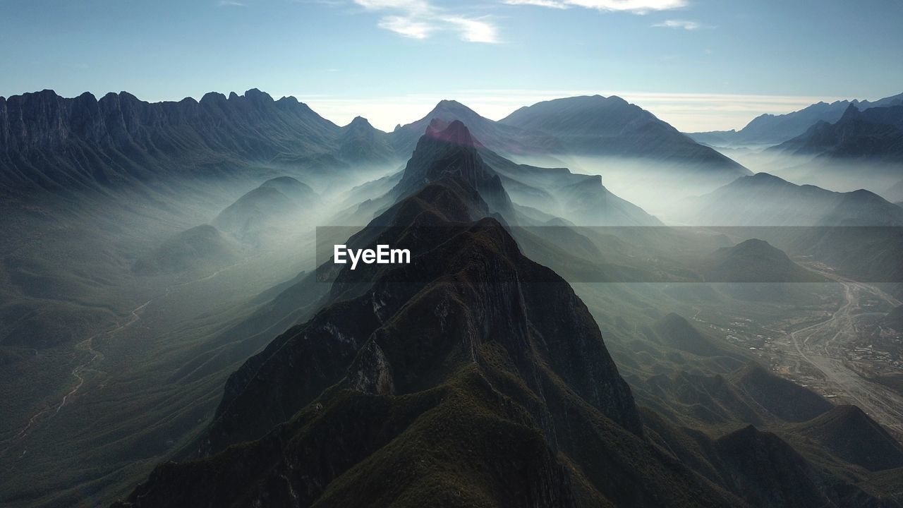 Scenic view of mountain ranges against sky