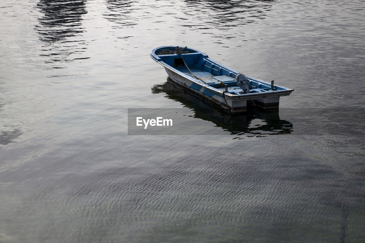 High angle view of boat moored in lake