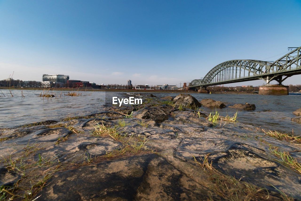 Bridge over river against clear sky