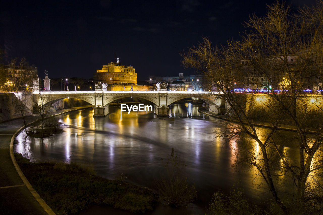 Landscape of the castel sant'angelo fortress and the vittorio emanuele ii bridge over the tiber.