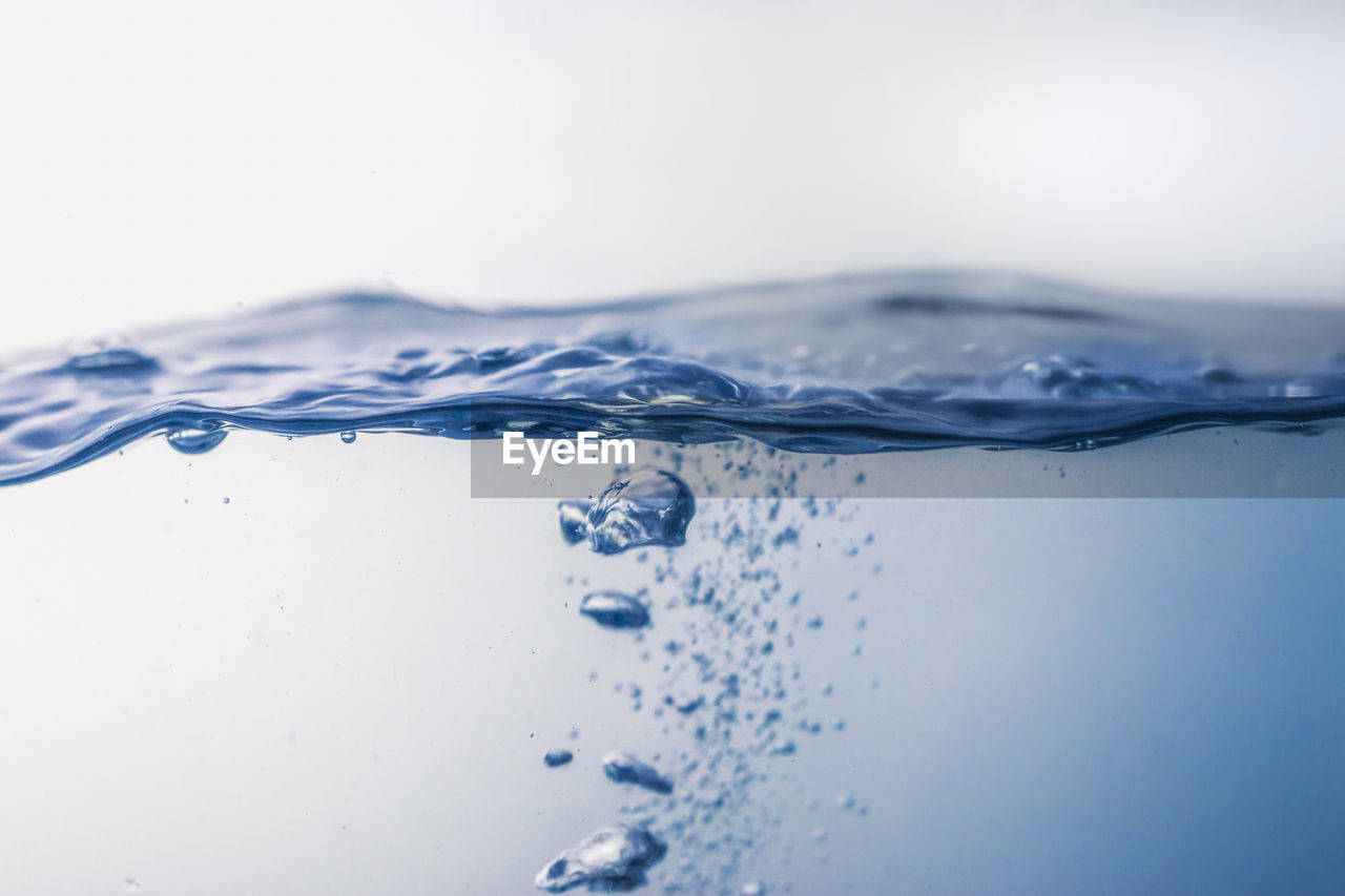 CLOSE-UP OF WATER DROPS ON GLASS