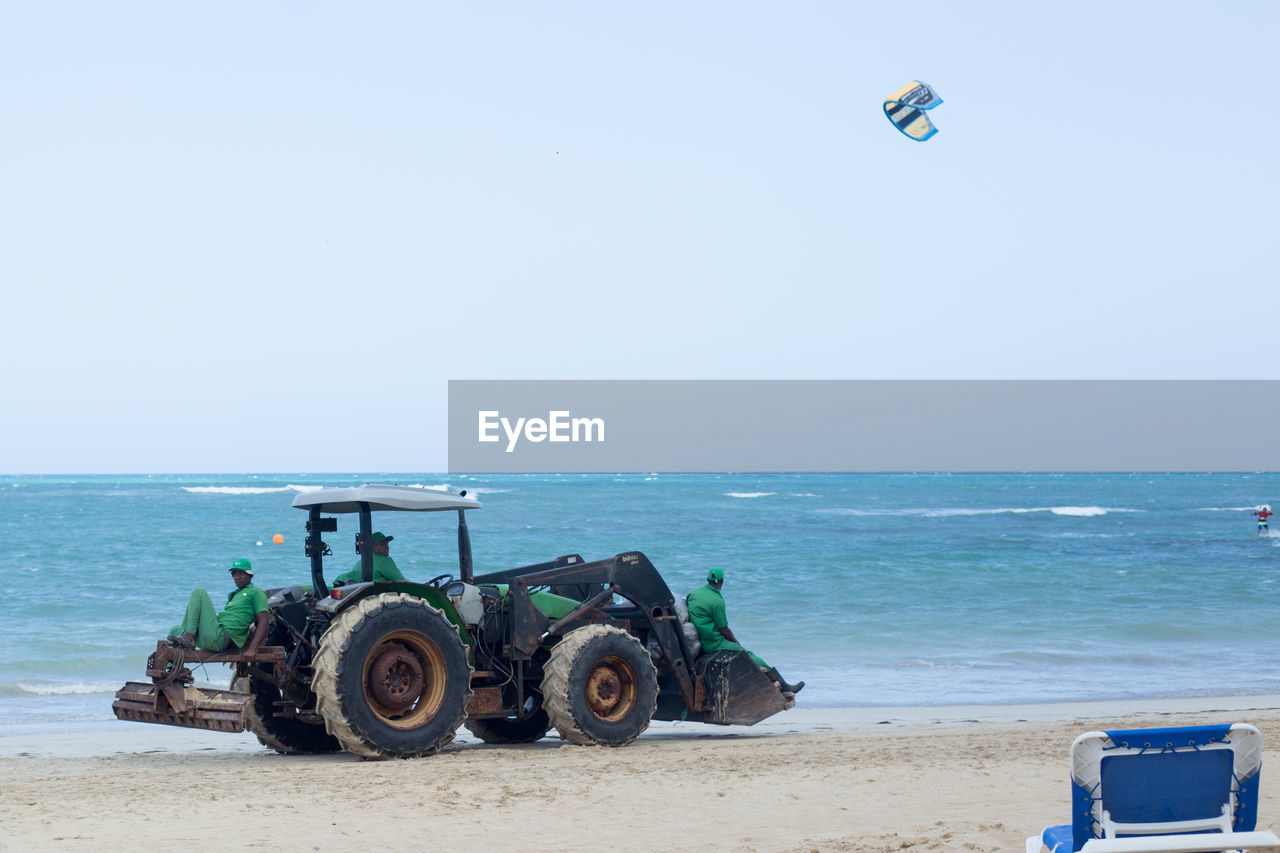 sea, land, transportation, water, beach, mode of transportation, sky, horizon, nature, horizon over water, tractor, vehicle, day, clear sky, sand, coast, motion, land vehicle, scenics - nature, sunny, shore, copy space, blue, travel, outdoors, ocean, beauty in nature