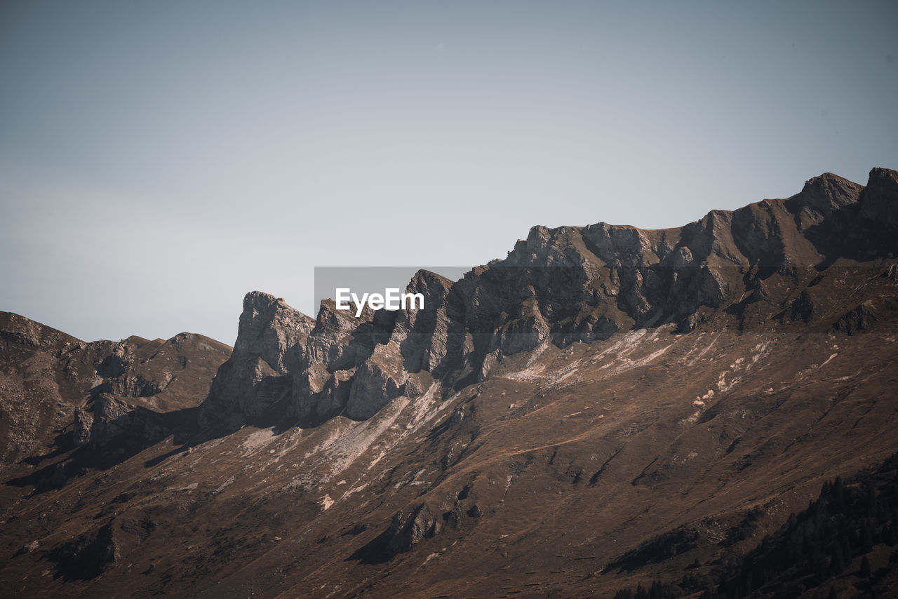 Scenic view of rocky mountains against clear sky
