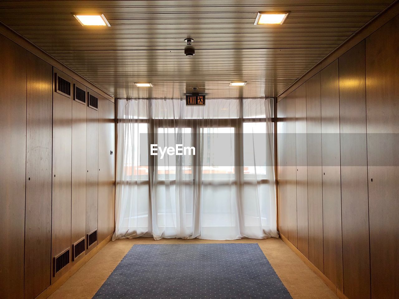 INTERIOR OF ILLUMINATED EMPTY BUILDING