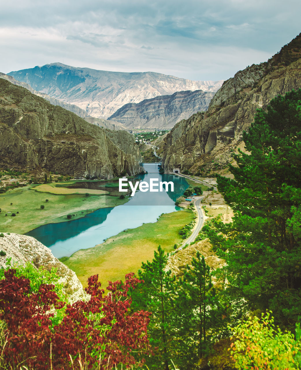 Scenic view of lake and mountains against sky