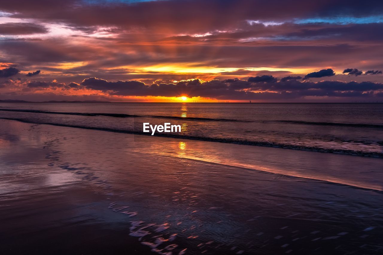 SCENIC VIEW OF SEA AGAINST ROMANTIC SKY