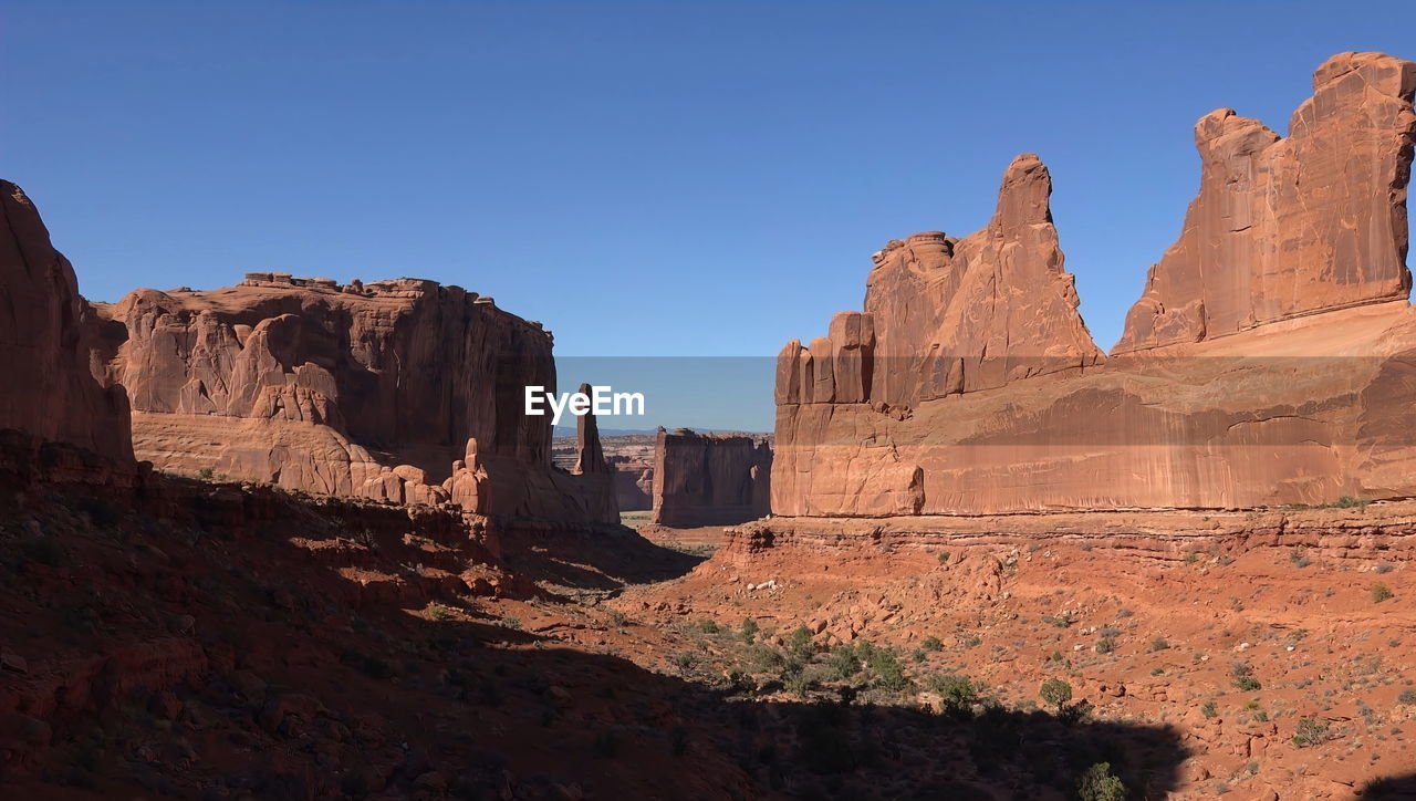 Rock formations against blue sky