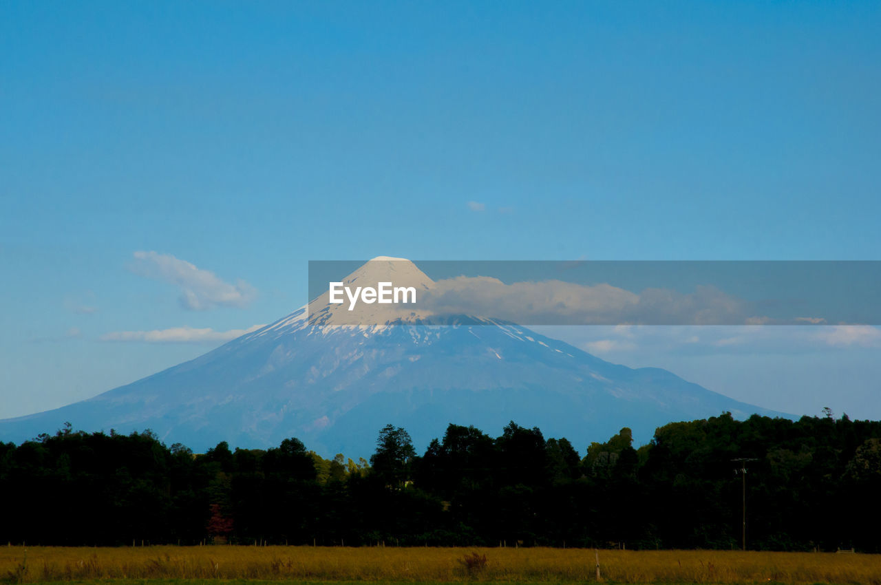 Scenic view of snowcapped mountain against sky