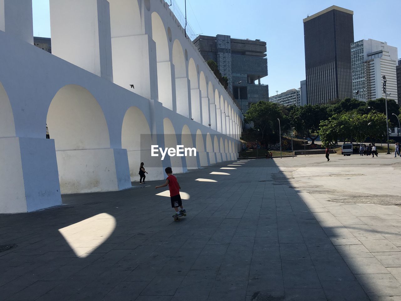 PEOPLE WALKING IN FRONT OF BUILDING