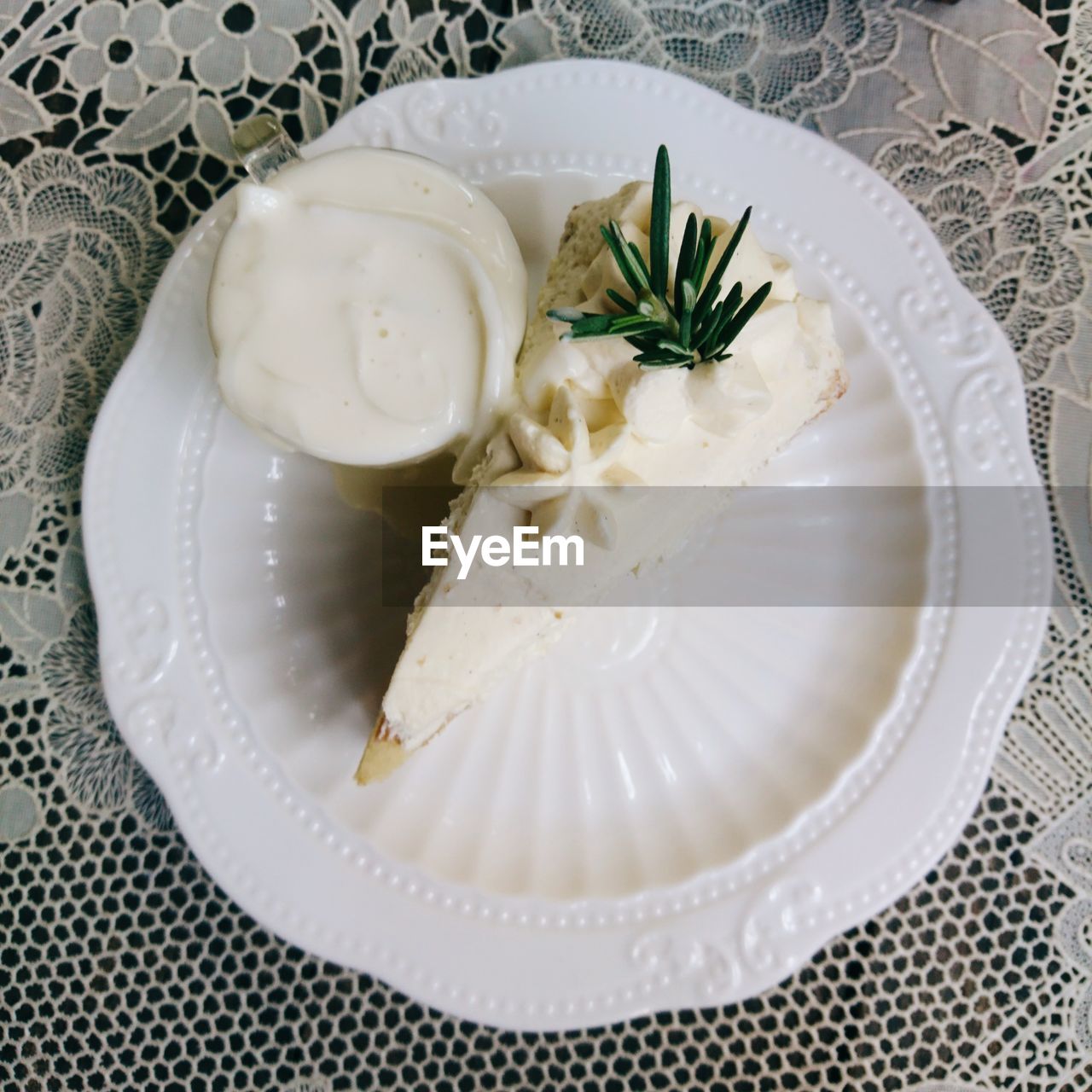High angle view of cake in plate on tablecloth