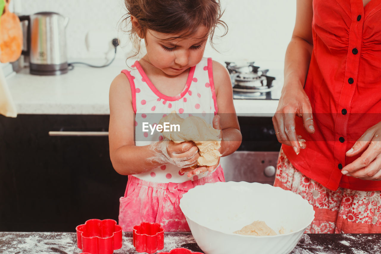 High angle view of girl having food at home