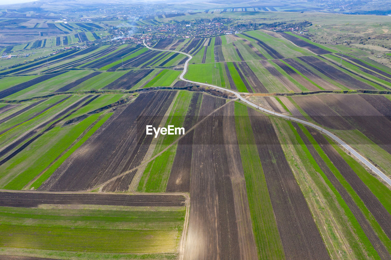 Aerial view of agricultural field against sky