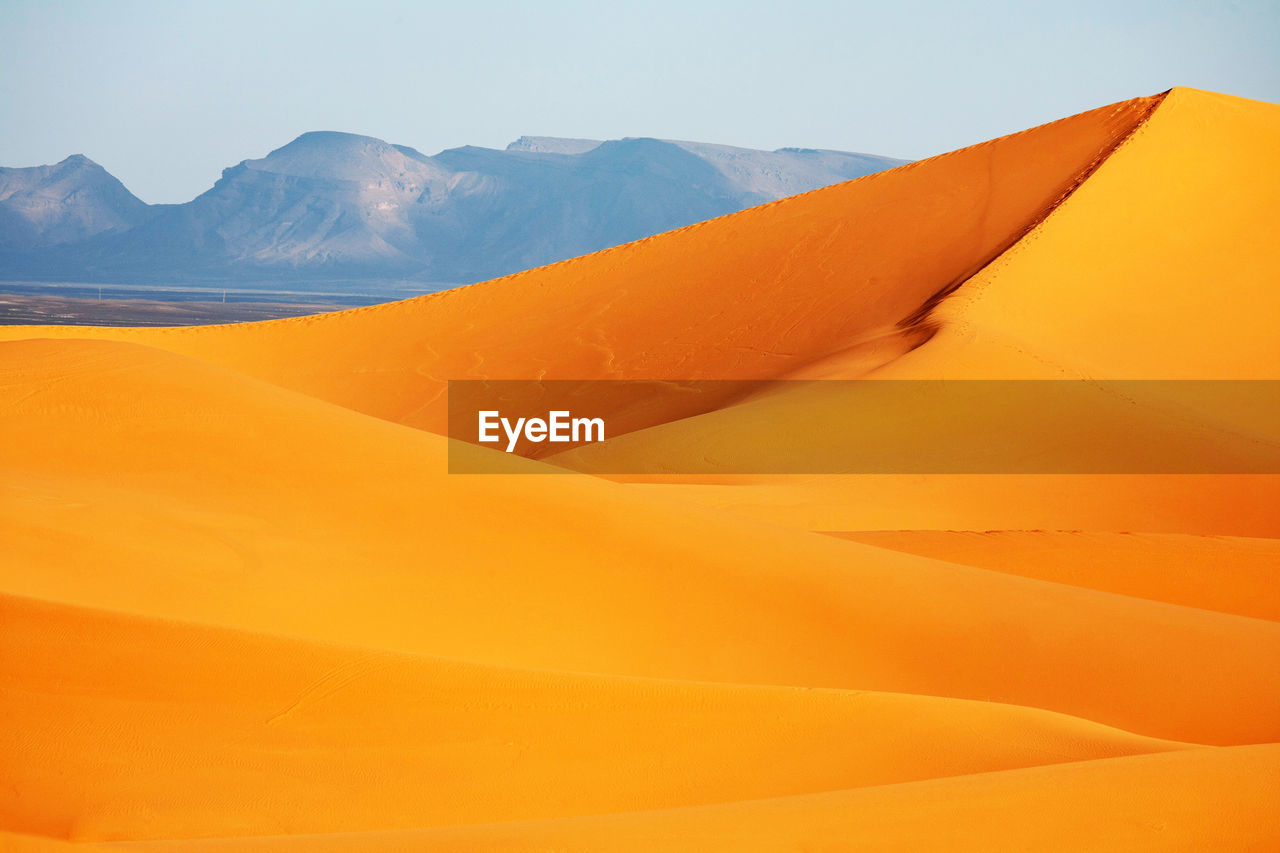 Scenic view of desert against clear sky