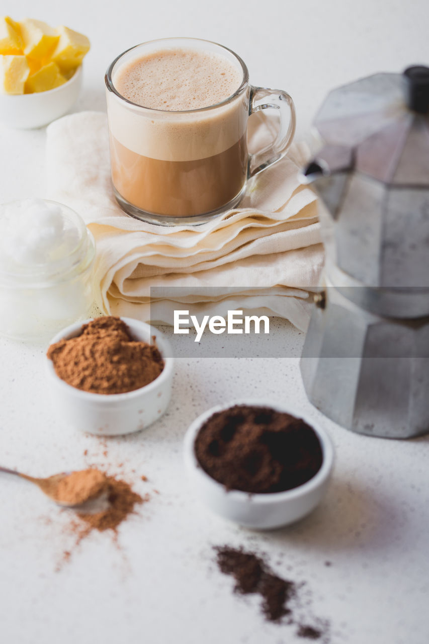 HIGH ANGLE VIEW OF COFFEE CUP WITH COOKIES