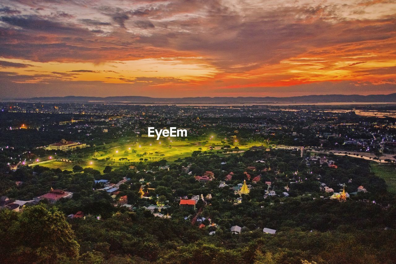 High angle view of city against sky during sunset