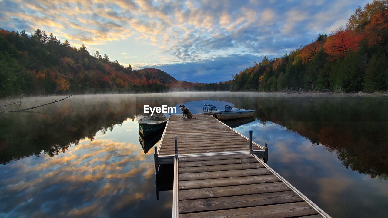 PIER ON LAKE DURING AUTUMN