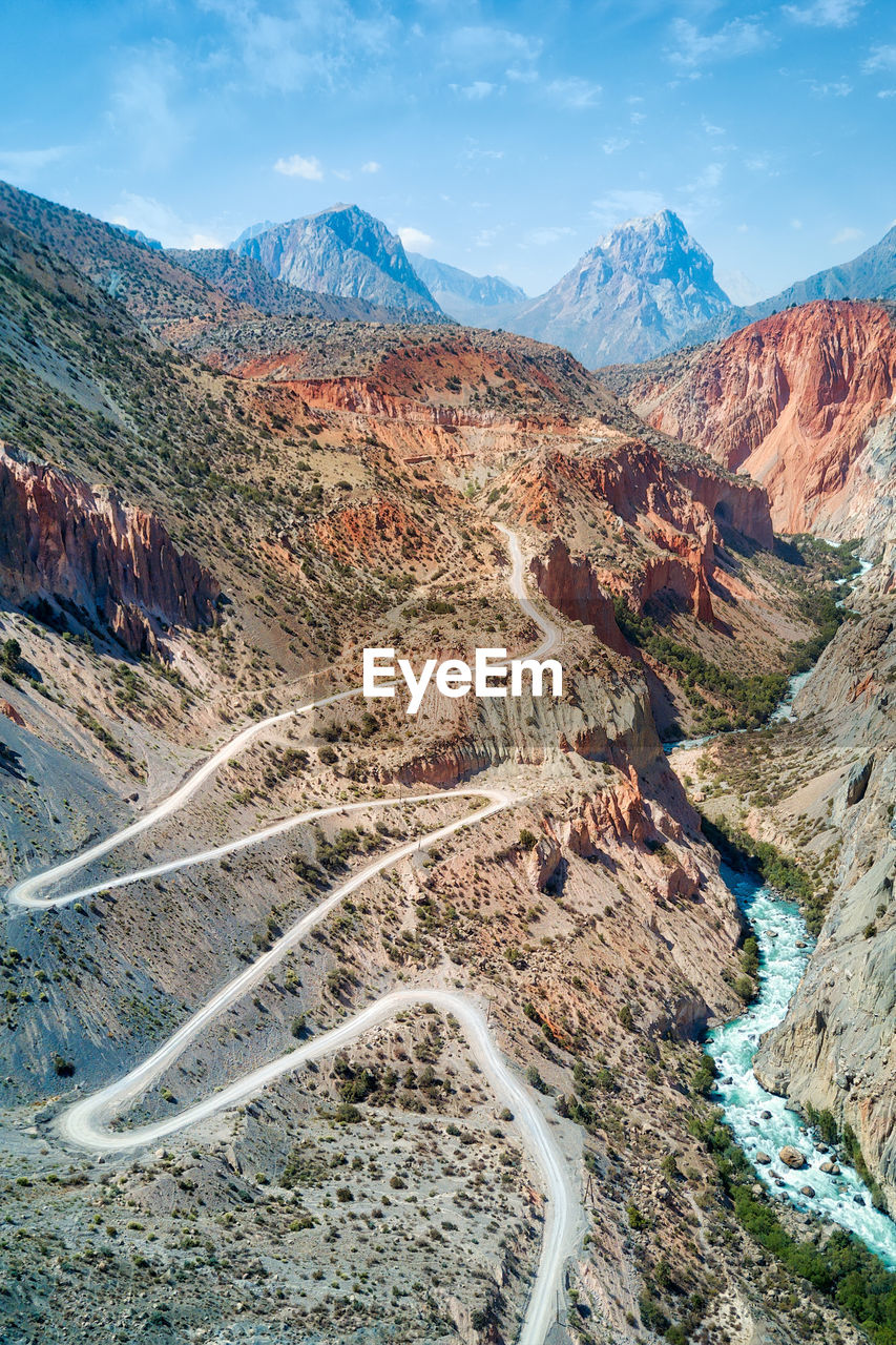Aerial view of landscape with mountain range in background