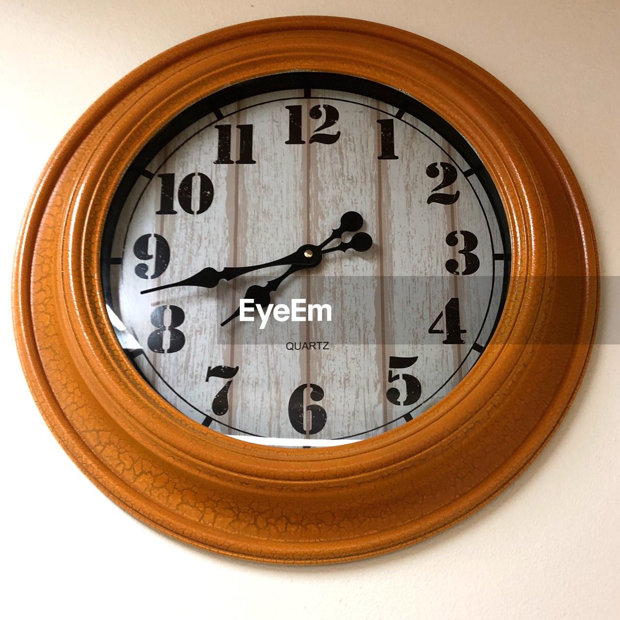 CLOSE-UP OF CLOCK AGAINST WHITE BACKGROUND