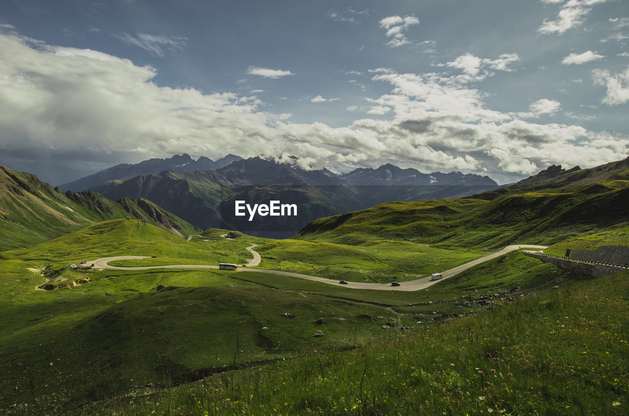 Scenic view of mountains against cloudy sky