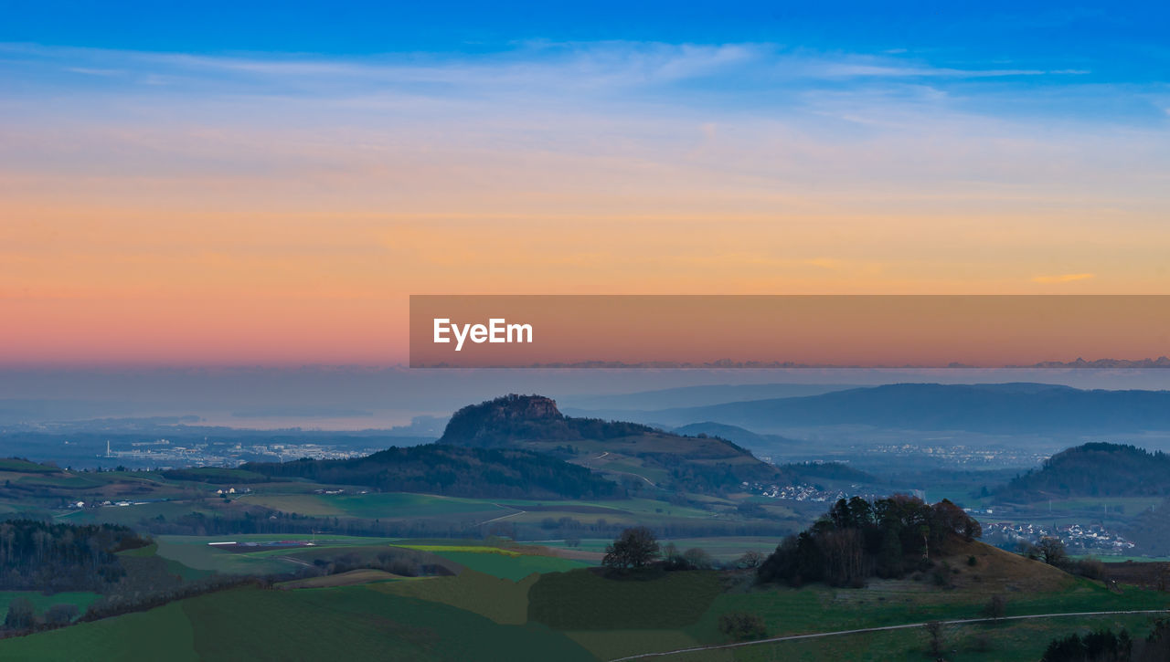 Scenic view of landscape against sky during sunset