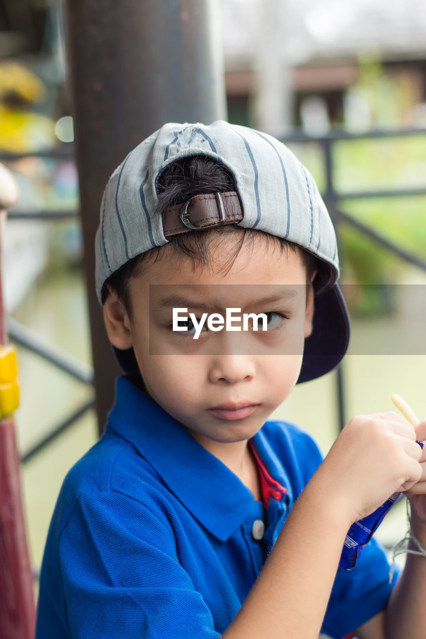 Portrait of boy wearing cap