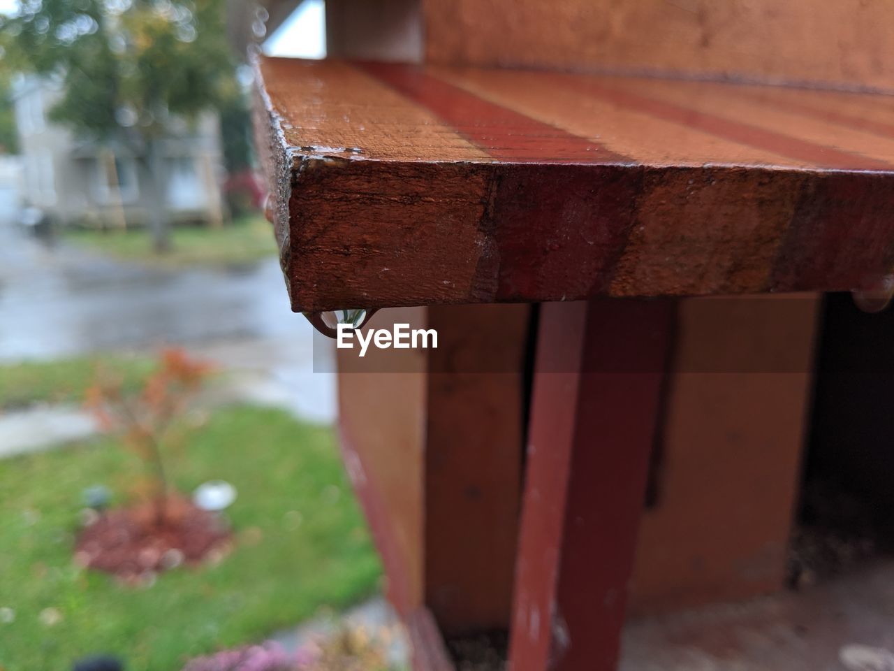 CLOSE-UP OF WET METAL STRUCTURE IN RAIN