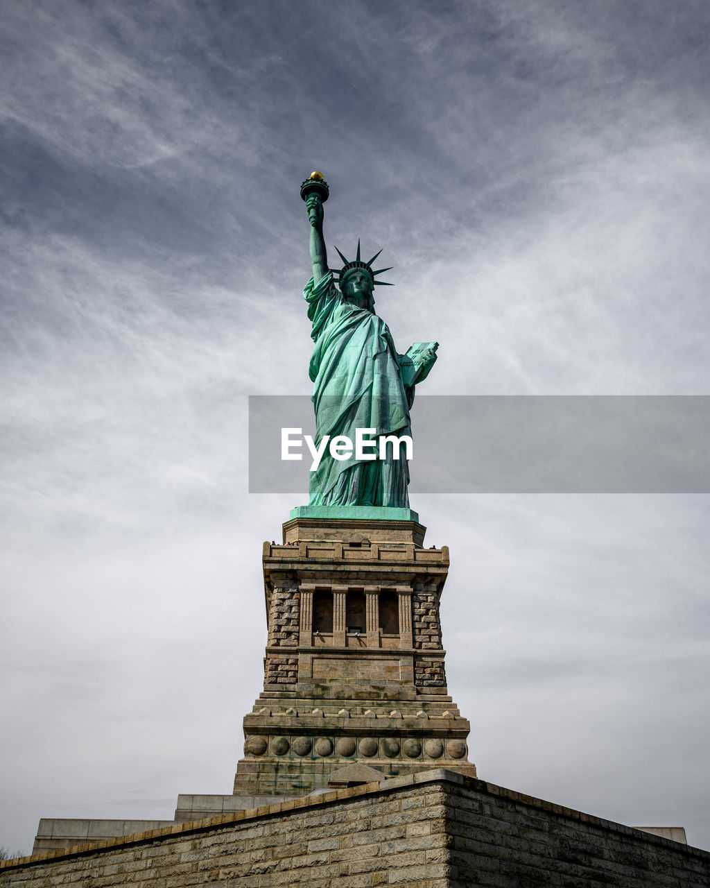 Low angle view of statue against sky during sunset