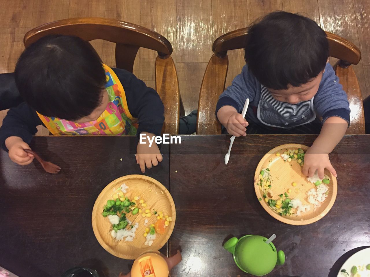 Directly above shot of babies having food at table
