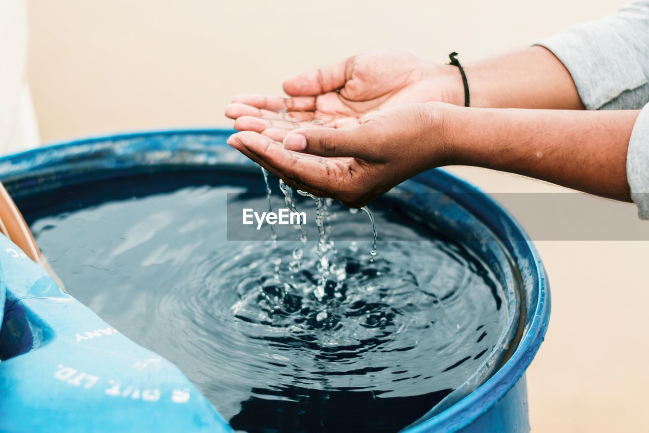 Close-up of hands in water