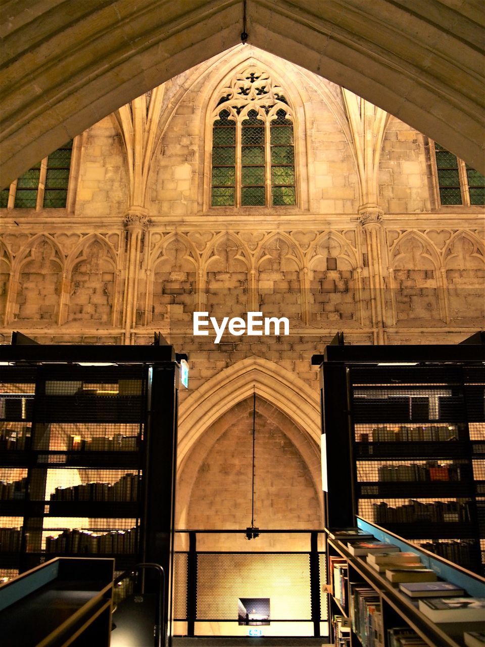 LOW ANGLE VIEW OF ILLUMINATED HISTORIC BUILDING IN CITY