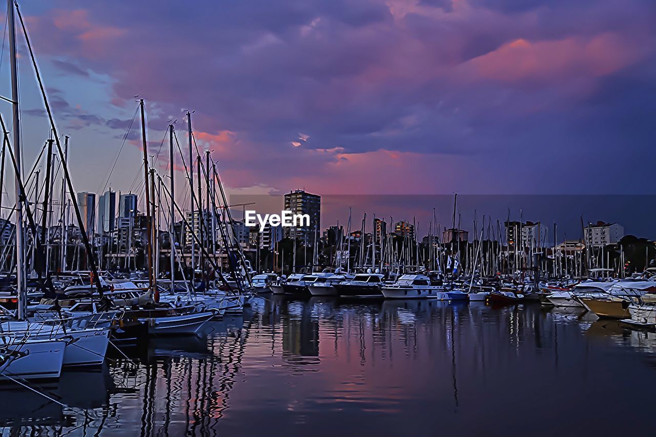 BOATS MOORED IN HARBOR