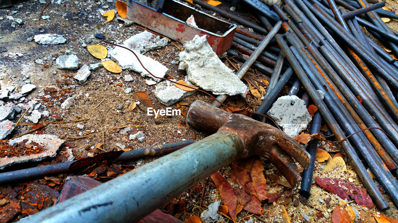 HIGH ANGLE VIEW OF BROKEN RUSTY METAL PIPE
