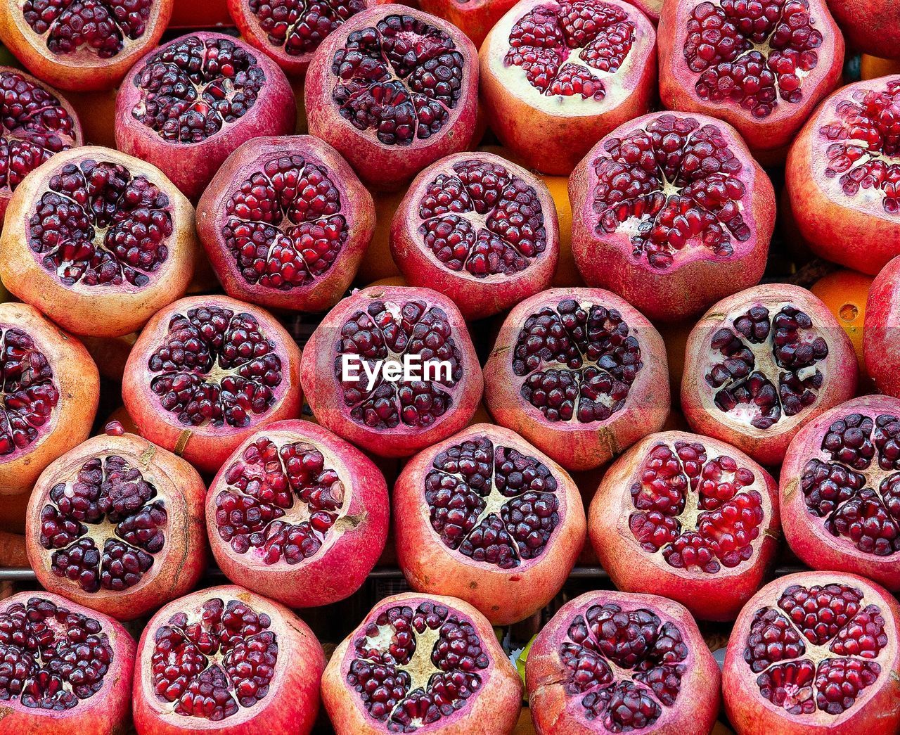 food and drink, food, healthy eating, pomegranate, plant, wellbeing, fruit, freshness, produce, no people, large group of objects, red, high angle view, abundance, full frame, backgrounds, berry, directly above, market, seed, for sale, still life, variation, arrangement