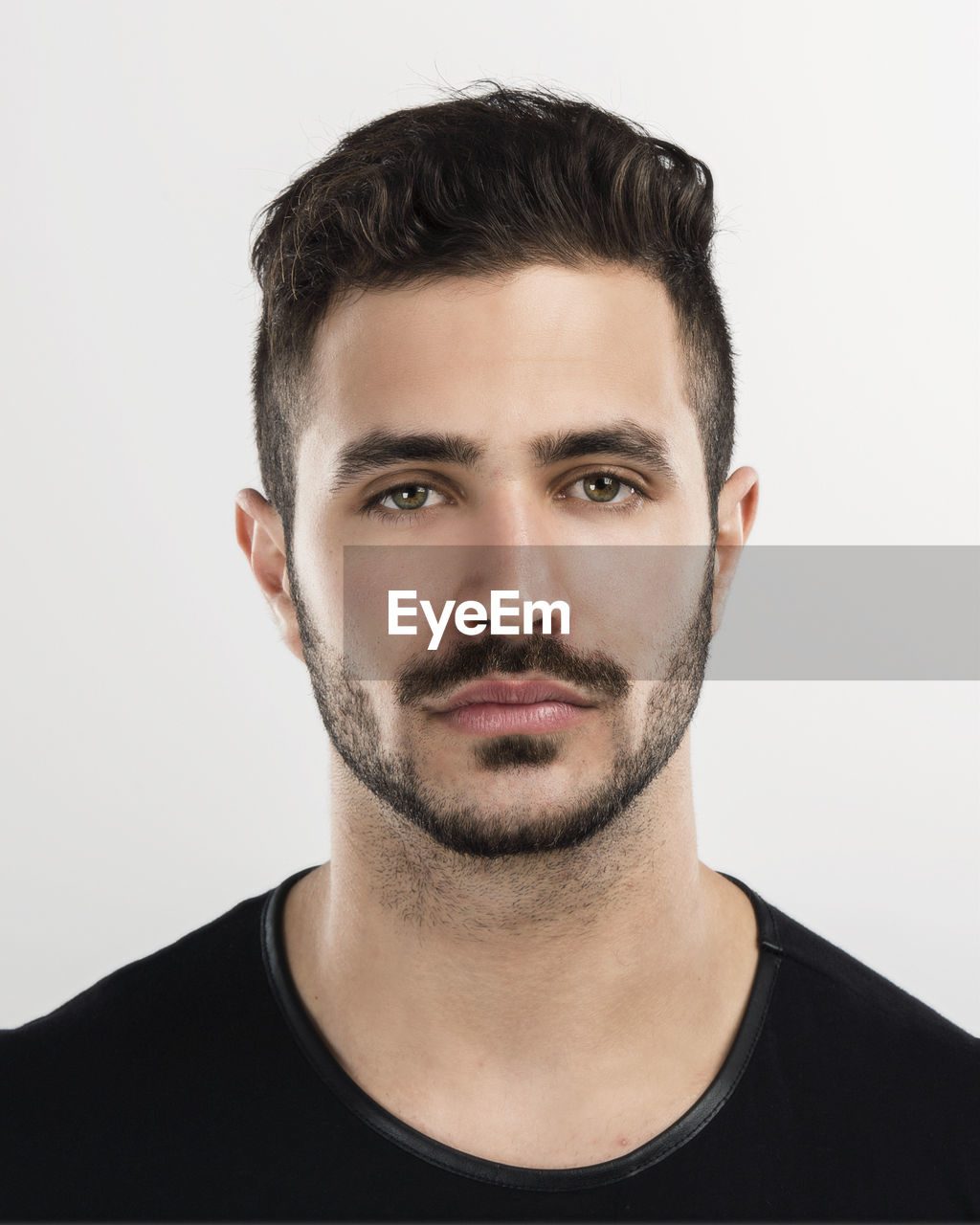 Studio portrait of a handsome young man astonished with something