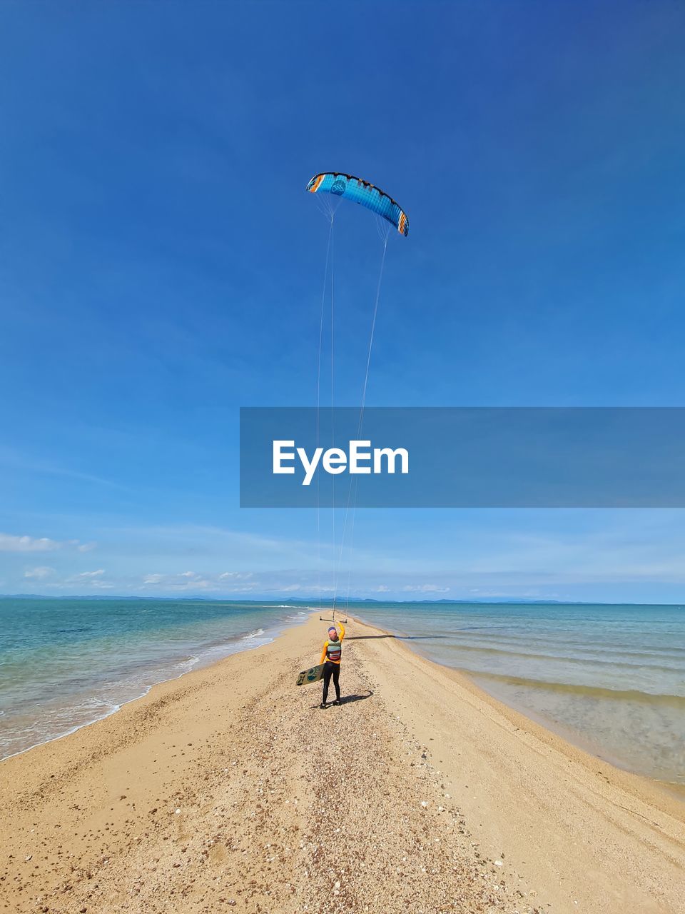 People on beach against sky