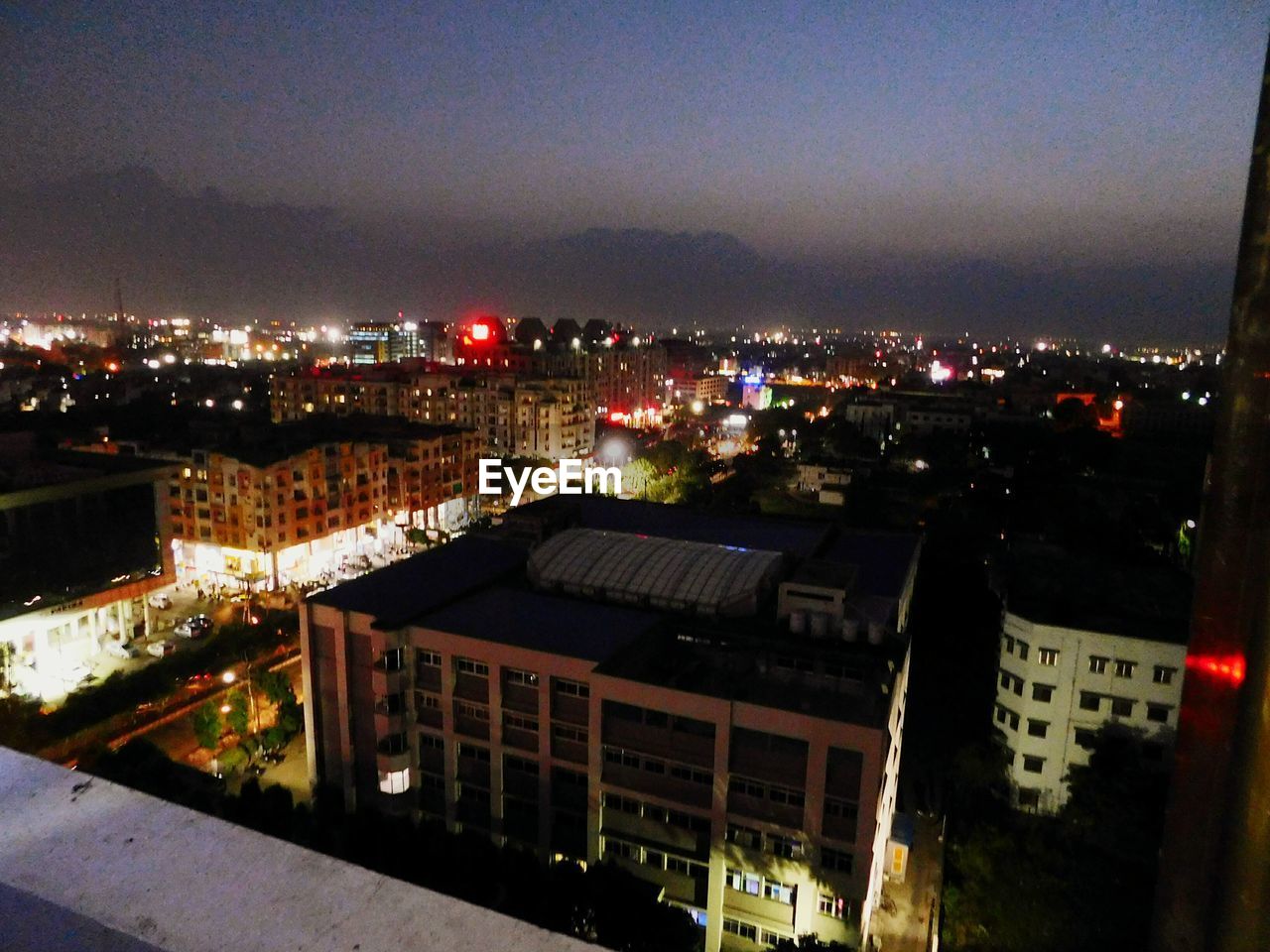 ILLUMINATED CITYSCAPE AT NIGHT