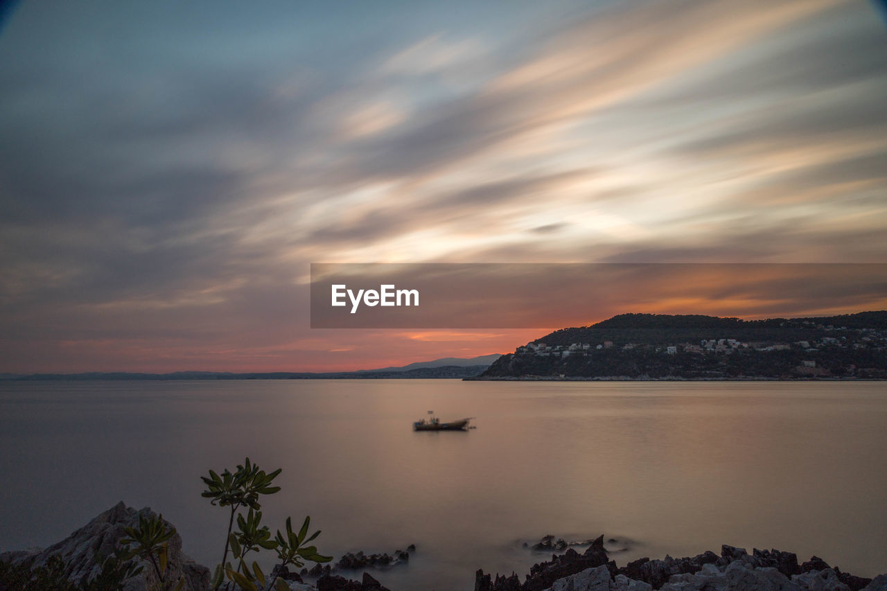 Scenic view of sea against sky during sunset