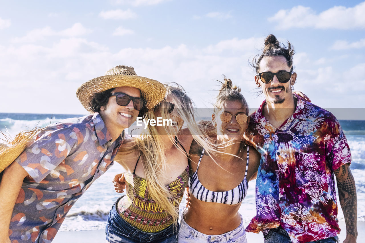 Happy friends enjoying at beach