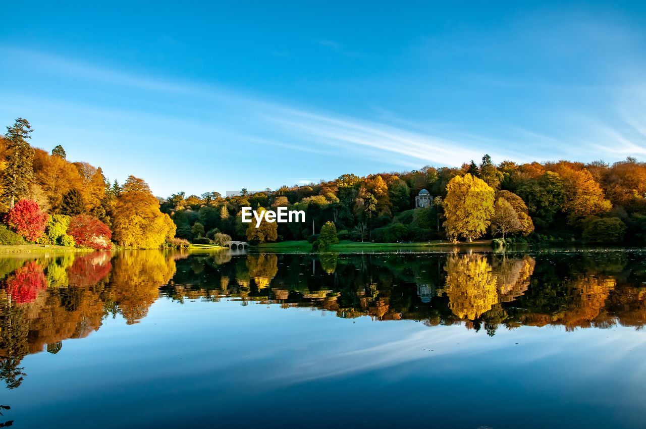 Scenic view of lake against sky during autumn