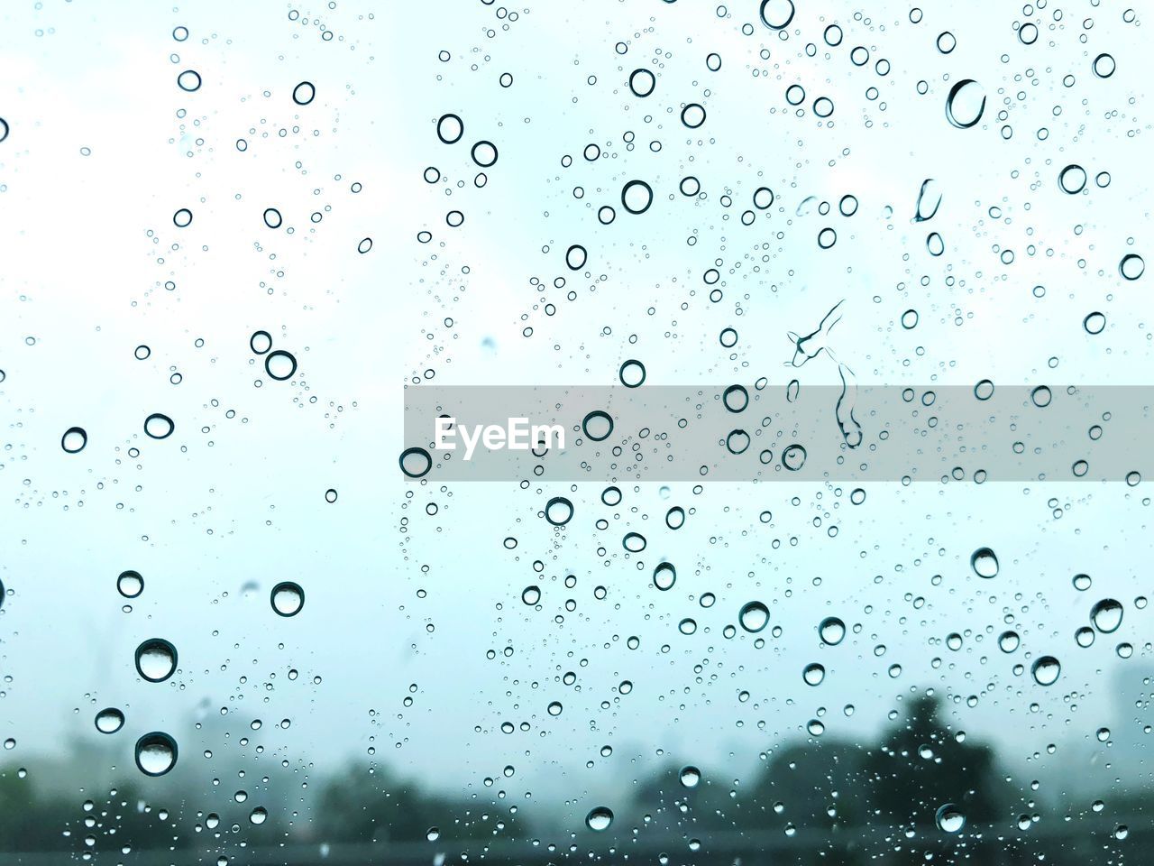 Full frame shot of wet car window during rainy season