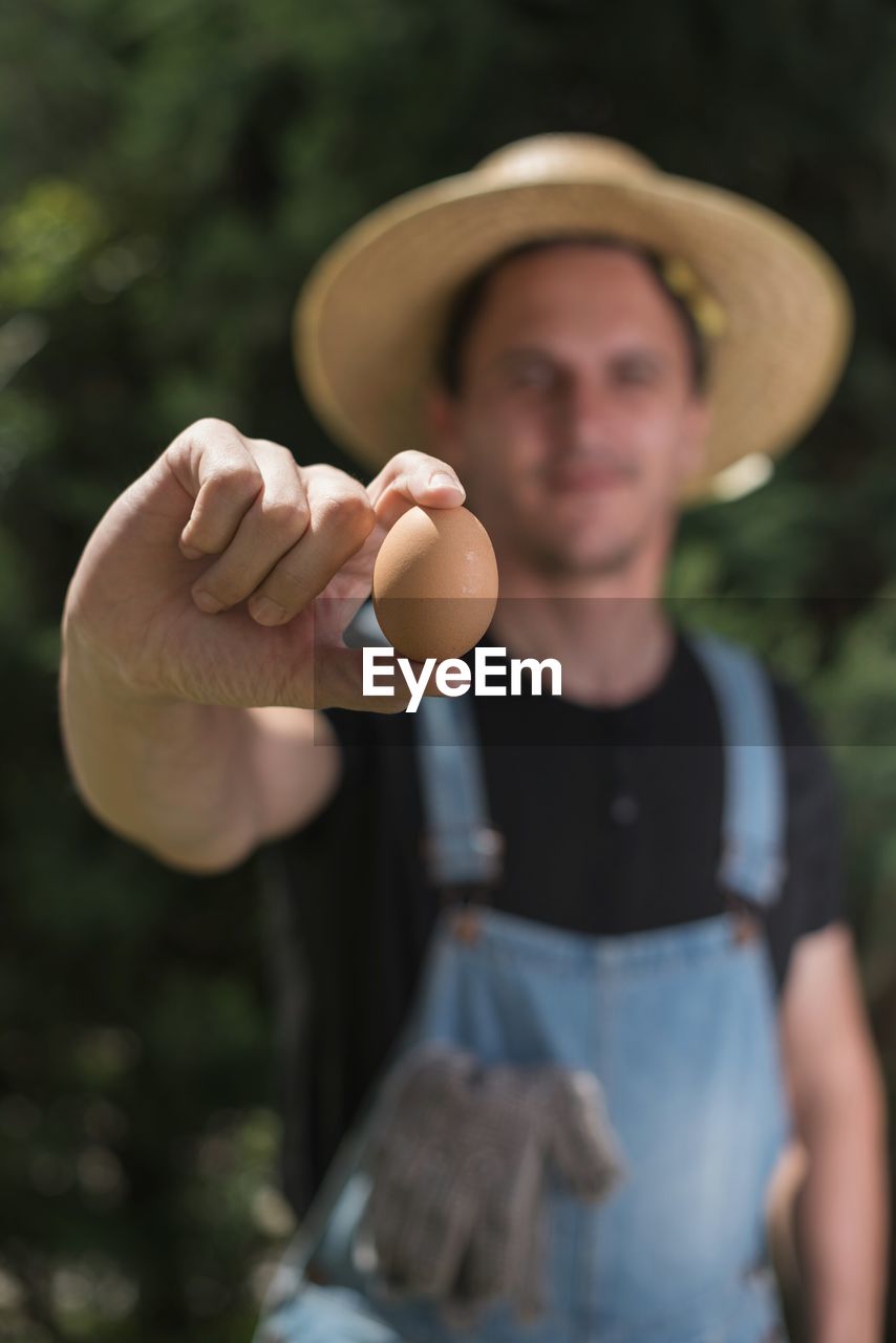 Close-up of person holding egg