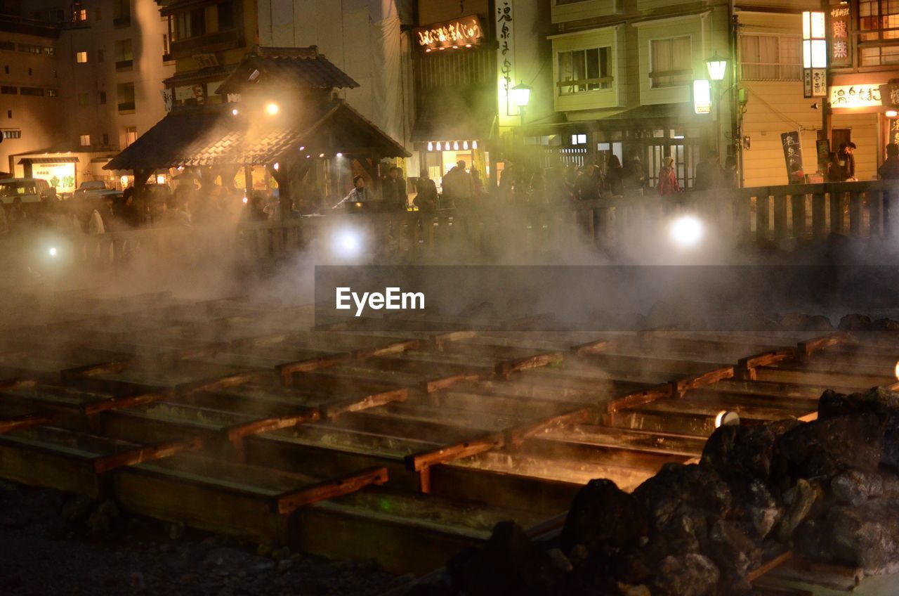 People by kusatsu onsen at night